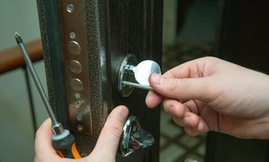 man-fixing-door-screwdriver-lock-260nw-1433478665.jpg